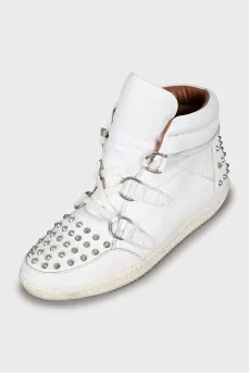 Leather sneakers decorated with spikes