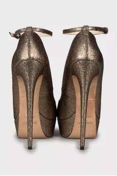 Golden high heels