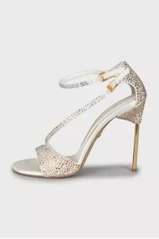 Sandals decorated with rhinestones on a stiletto heel