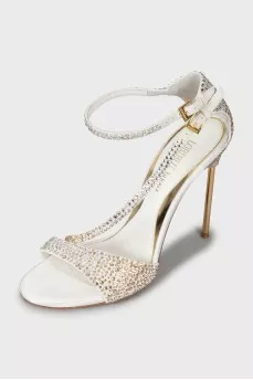Sandals decorated with rhinestones on a stiletto heel