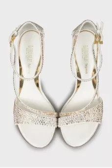 Sandals decorated with rhinestones on a stiletto heel