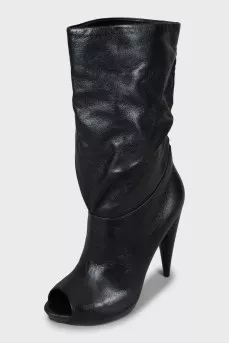 Wedge heel boots with tag