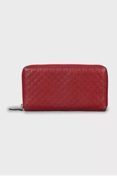 Wallet with branded embossed leather