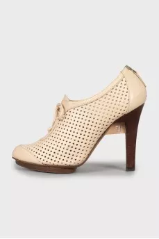 Ankle boots with perforated leather
