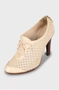Ankle boots with perforated leather