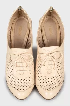 Ankle boots with perforated leather