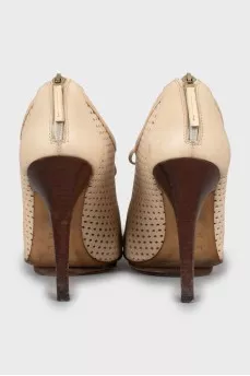 Ankle boots with perforated leather