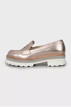 Gold loafers with embossed leather