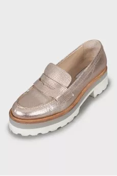 Gold loafers with embossed leather
