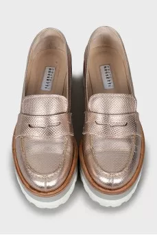 Gold loafers with embossed leather