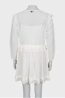 Fitted dress with ruffles and perforation