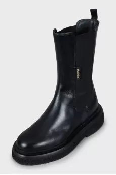 Black boots with textile inserts