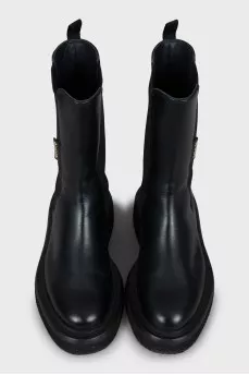 Black boots with textile inserts