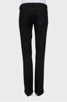 Dark grey trousers with arrows