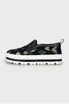 Textile slip-ons on a high platform