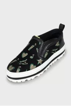 Textile slip-ons on a high platform