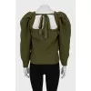 Green sweater with voluminous sleeves