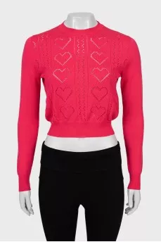 Pink jumper with perforated pattern