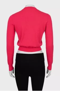 Pink jumper with perforated pattern