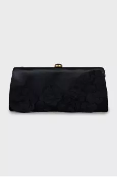 Textile clutch decorated with flowers