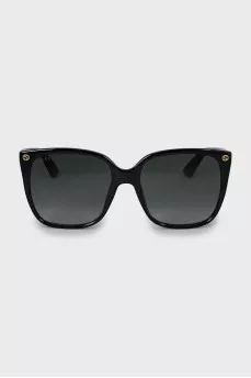 Black sunglasses with gold logo