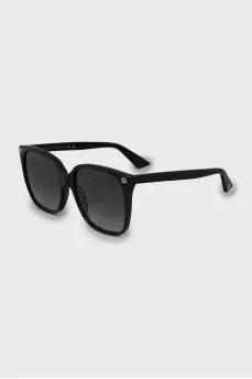 Black sunglasses with gold logo