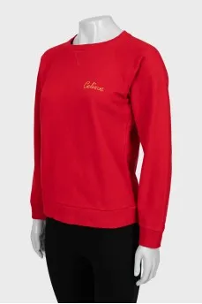 Red sweatshirt with gold logo