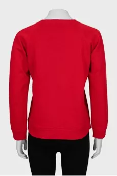 Red sweatshirt with gold logo