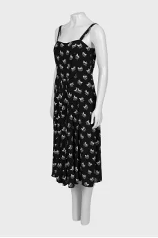 Jumpsuit with straps in the signature print