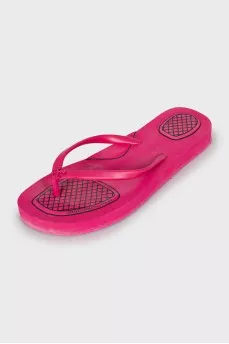 Pink flip flops with brand logo