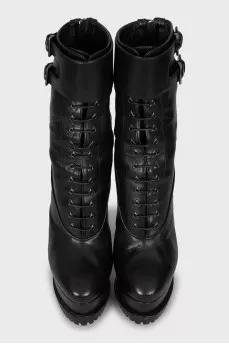 Leather ankle boots decorated with straps