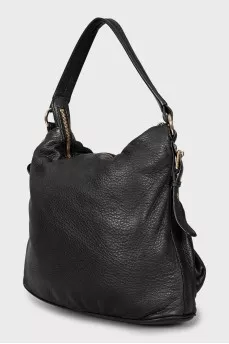 Leather bag decorated with straps