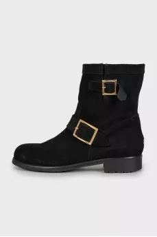 Suede boots decorated with buckles