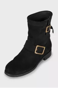 Suede boots decorated with buckles