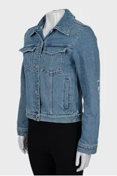 Denim jacket with decorated sleeves