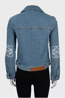 Denim jacket with decorated sleeves