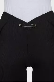 Trousers decorated with a pin