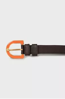 Leather belt with orange buckle