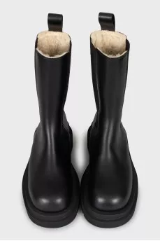 Insulated leather boots with a massive sole
