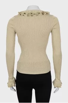 Jumper with frills on sleeves and collar