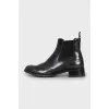 Leather boots decorated with perforation