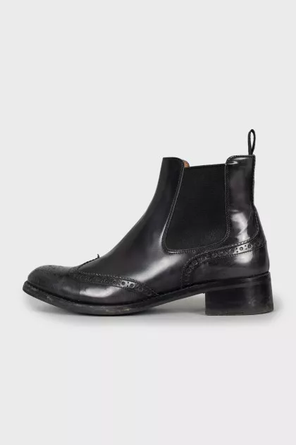 Leather boots decorated with perforation