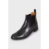 Leather boots decorated with perforation
