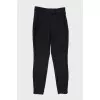 Slim-fit trousers with zippers at the bottom