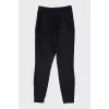 Slim-fit trousers with zippers at the bottom