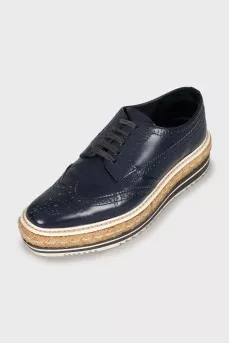 Platform shoes decorated with braiding