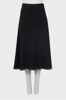 Skirt decorated with metal rings