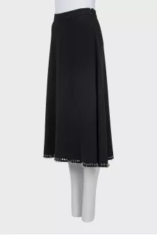 Skirt decorated with metal rings