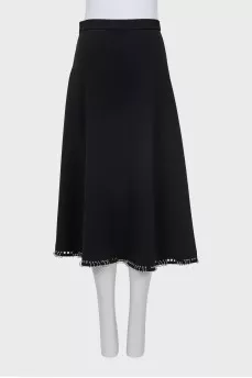 Skirt decorated with metal rings
