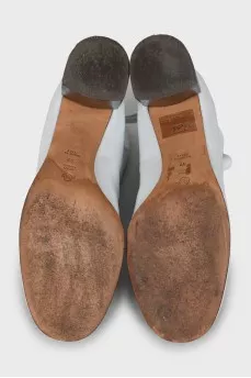 White leather ankle boots